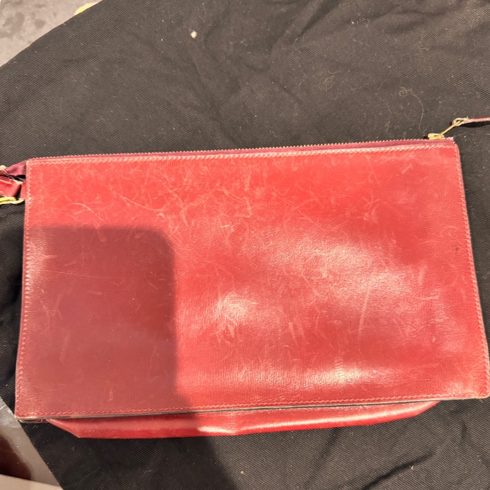 Authentic burgundy red leather lined toiletry-type pouch with zipper closure